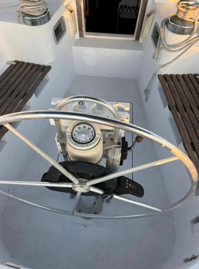Slide: The Image of Cockpit of 1985 Gib'Sea 126 sailboat with steering wheel and navigation equipment. - 31