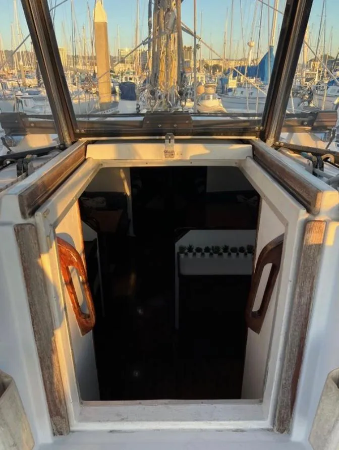 Slide: The Image of Gib'Sea 126 sailboat cabin entrance, 1985 model, docked at marina. - 33