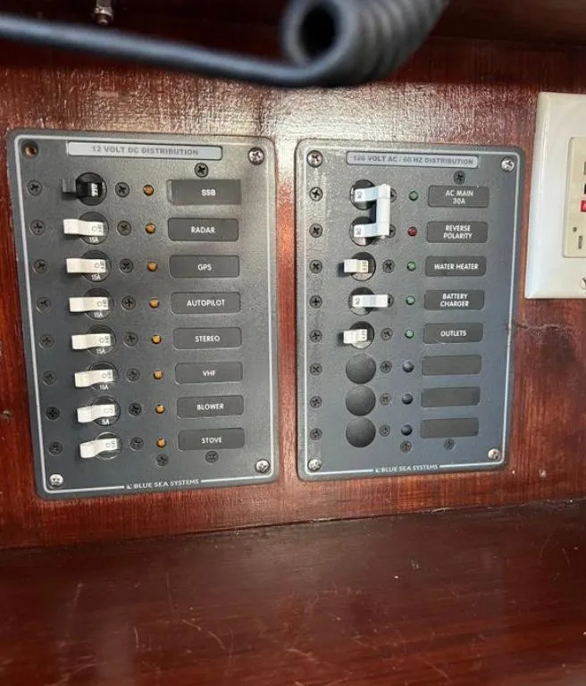 Slide: The Image of Control panel of a 1985 Gib'Sea 126 sailboat with labeled switches and indicators. - 41