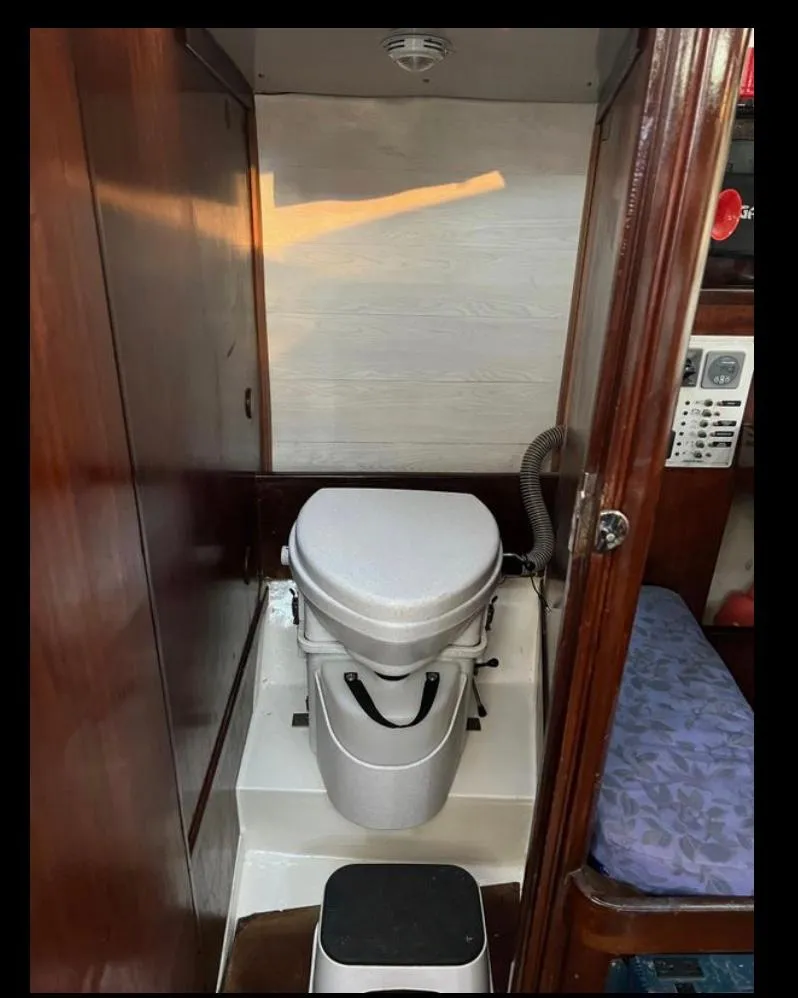 Slide: The Image of 1985 Gib'Sea 126 yacht bathroom with compact marine toilet. - 49