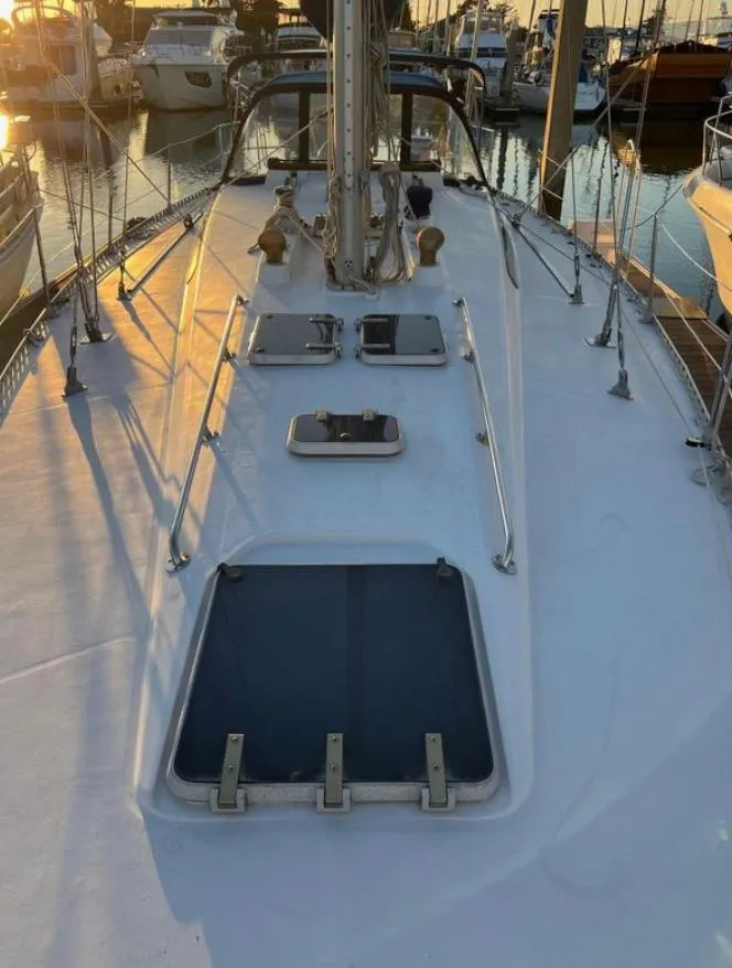 Slide: The Image of 1985 Gib'Sea 126 sailboat deck at sunset in marina. - 9