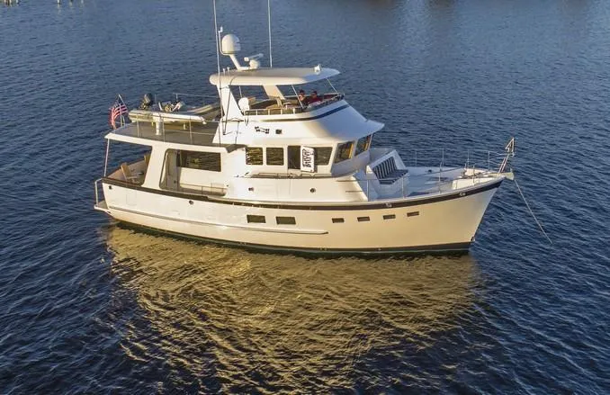 The Image of 2027 Krogen 50 Open yacht cruising on a sunny day in open waters. - 0