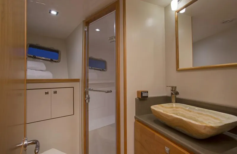 Slide: The Image of Modern bathroom in 2025 Krogen 50 Open yacht with vessel sink and shower. - 12