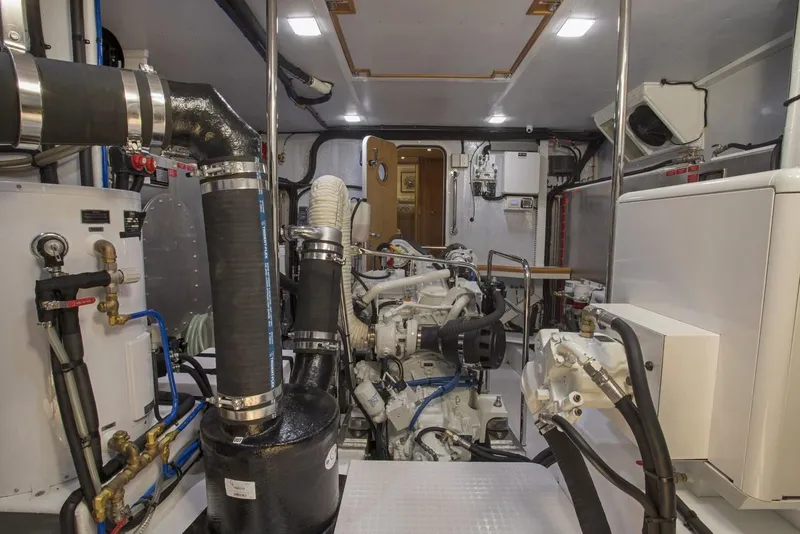 Slide: The Image of Engine room of 2025 Krogen 50 Open yacht with modern equipment and piping. - 19