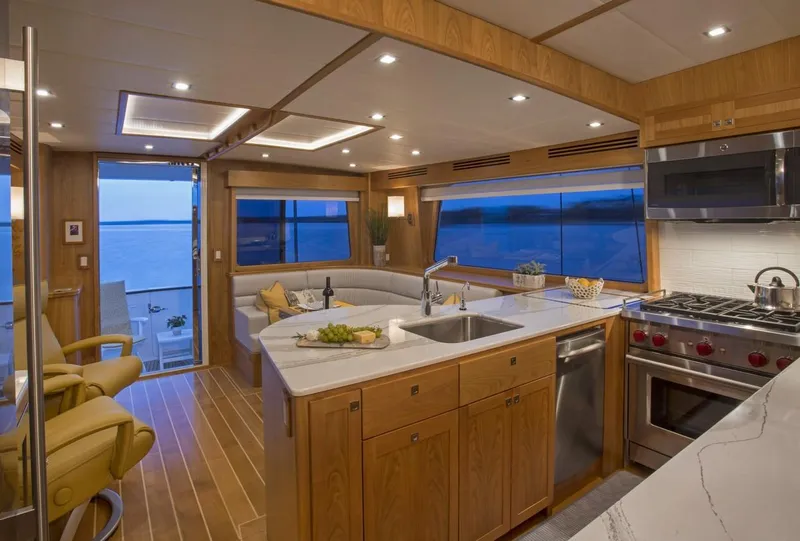 Slide: The Image of Luxurious interior of 2025 Krogen 50 Open yacht with modern kitchen and scenic ocean view. - 2