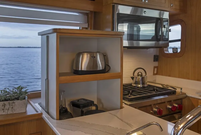 Slide: The Image of Modern kitchen in 2025 Krogen 50 Open yacht with ocean view. - 3