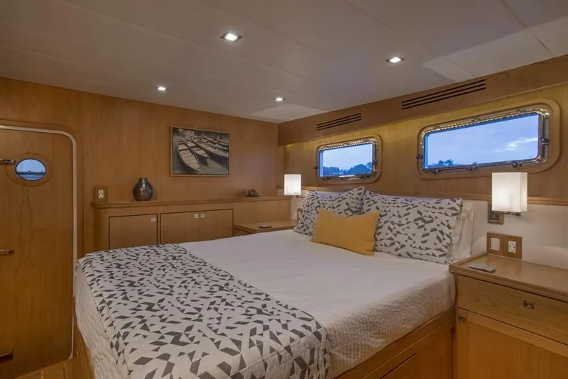 Slide: The Image of Luxurious bedroom in 2025 Krogen 50 Open yacht with modern decor and large bed. - 6