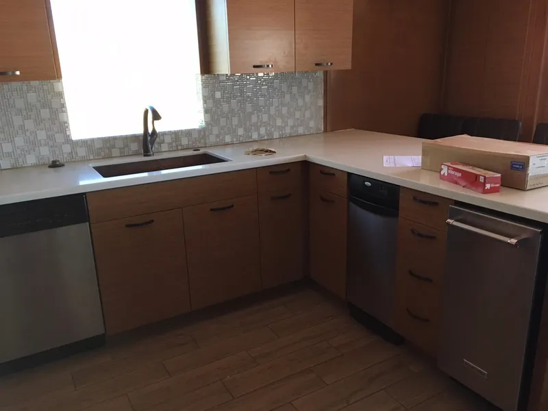 Slide: The Image of Modern kitchen with wooden cabinets, stainless steel appliances, and tiled backsplash, Bravada Imagination Trip #15. - 10