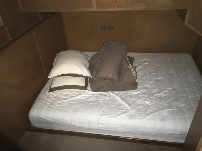 Slide: The Image of Bed with pillows in Bravada Imagination Trip #15, 2014 model, wooden interior. - 13