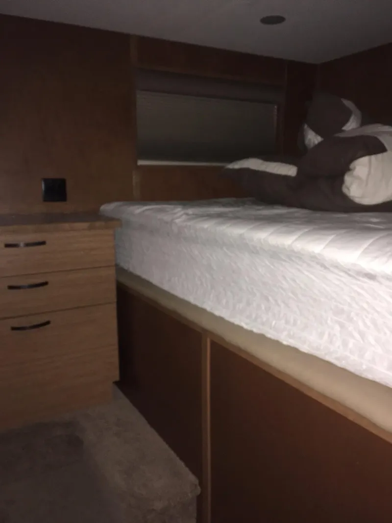 Slide: The Image of Interior of 2014 Bravada Imagination Trip #15, featuring a cozy bed and wooden cabinetry. - 17