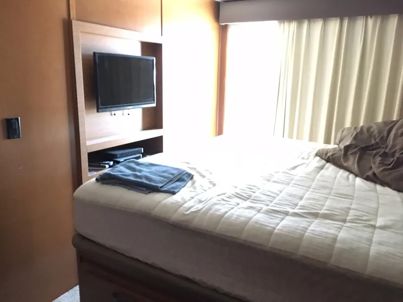 Slide: The Image of Interior of Bravada Imagination Trip #15, 2014 model, featuring a cozy bedroom with TV. - 20