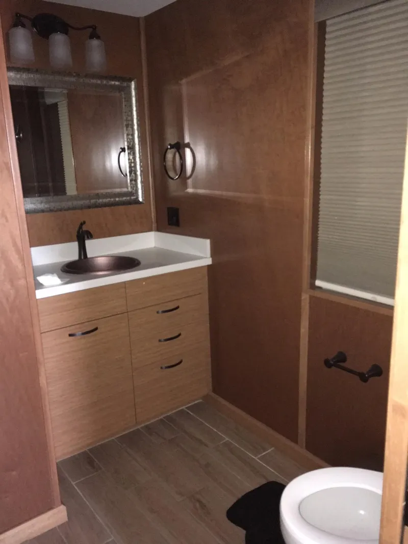 Slide: The Image of Modern bathroom in Bravada Imagination Trip #15, 2014, with wood accents and sleek fixtures. - 22