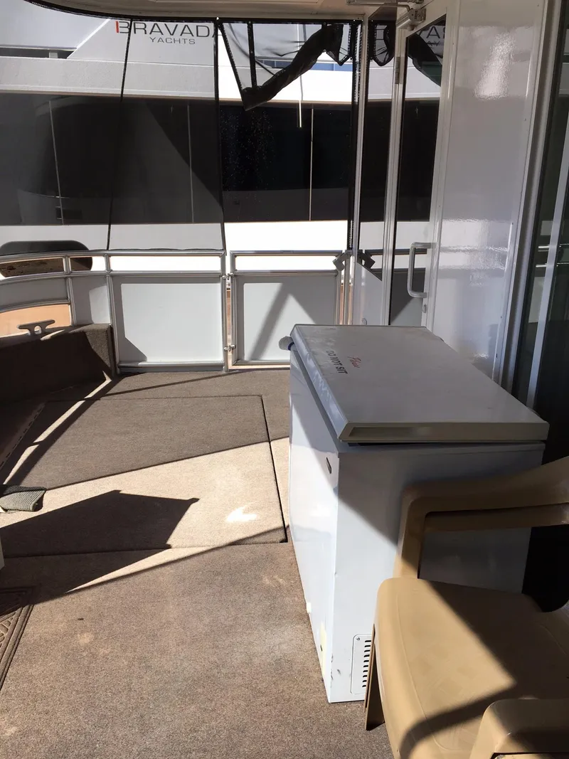 Slide: The Image of Interior view of Bravada Imagination Trip #15 houseboat, featuring a white chest freezer. - 25