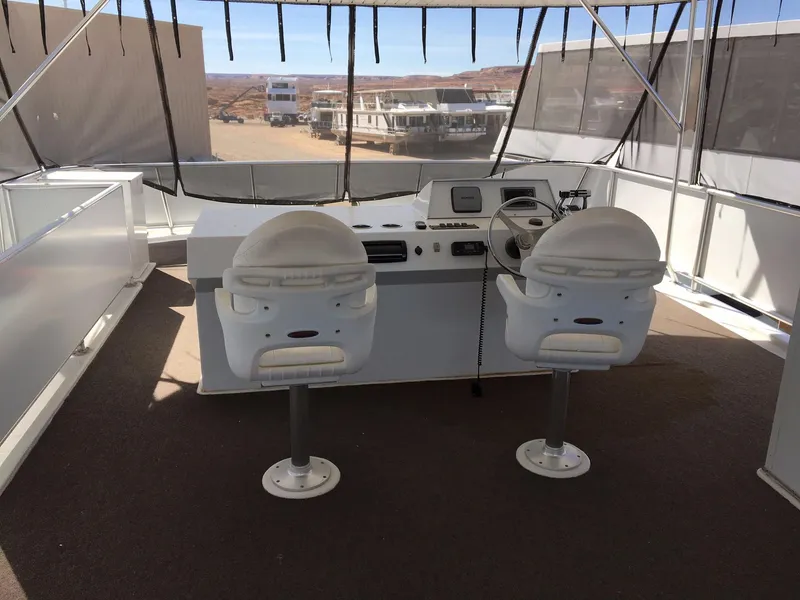 Slide: The Image of Helm of 2014 Bravada Imagination Trip #15 houseboat with dual captain chairs. - 27