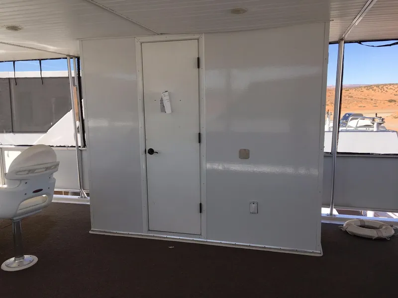 Slide: The Image of Interior of 2014 Bravada Imagination Trip #15 houseboat with white door and chair. - 28