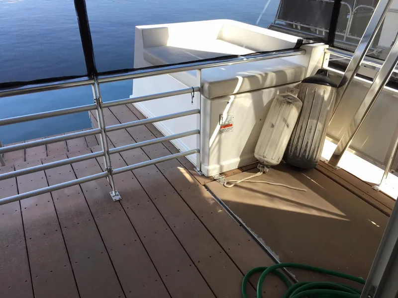 Slide: The Image of Deck of 2014 Bravada Imagination Trip #15 houseboat with railing and seating. - 3