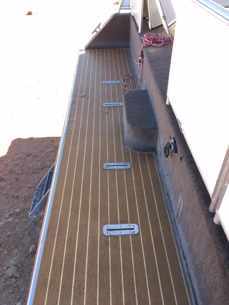 Slide: The Image of Deck of 2014 Bravada Imagination Trip #15 with wood-like finish and metal fixtures. - 33