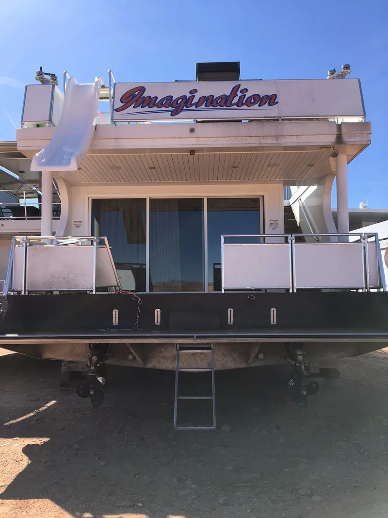 Slide: The Image of Bravada Imagination Trip #15 houseboat, 2014 model, featuring a slide and spacious deck. - 4
