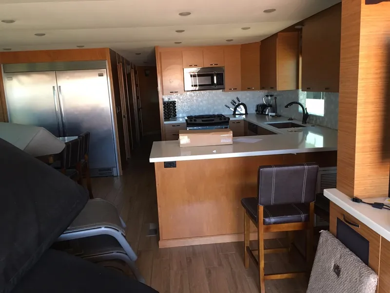 Slide: The Image of Modern kitchen interior in Bravada Imagination Trip #15, 2014 model, featuring sleek appliances and wood finishes. - 6