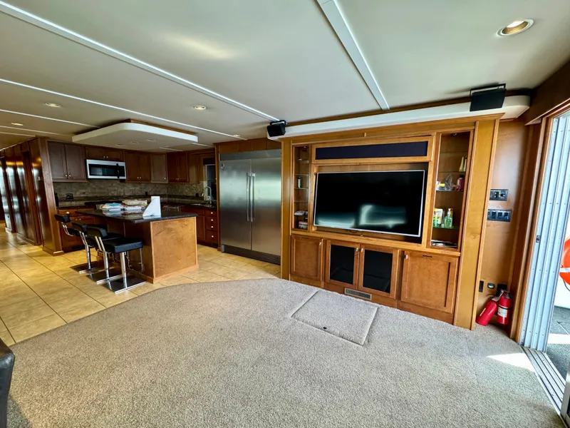 Slide: The Image of Luxurious interior of 2012 Bravada Helios Trip #8 with modern kitchen and entertainment area. - 14