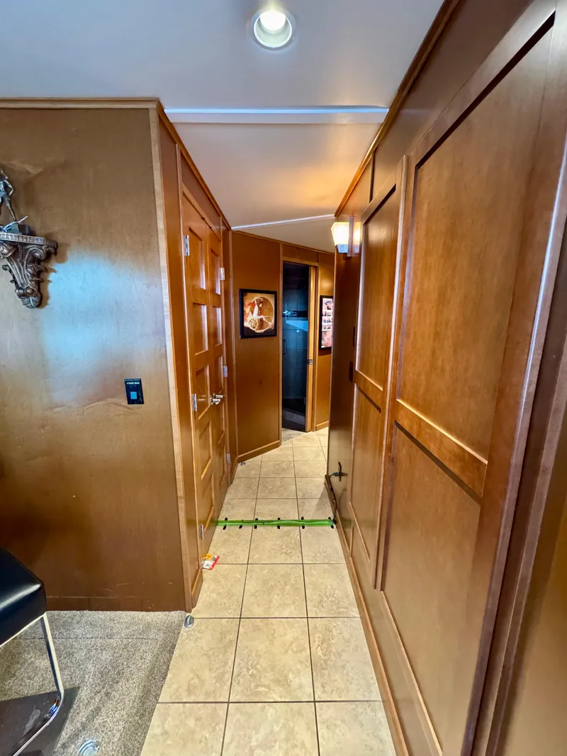 Slide: The Image of Hallway in 2012 Bravada Helios Trip #8 with wooden paneling and tiled floor. - 3