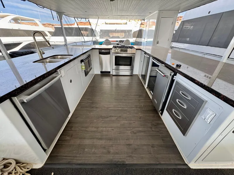 Slide: The Image of Spacious deck of 2012 Bravada Helios Share #8 with outdoor seating and grills. - 21