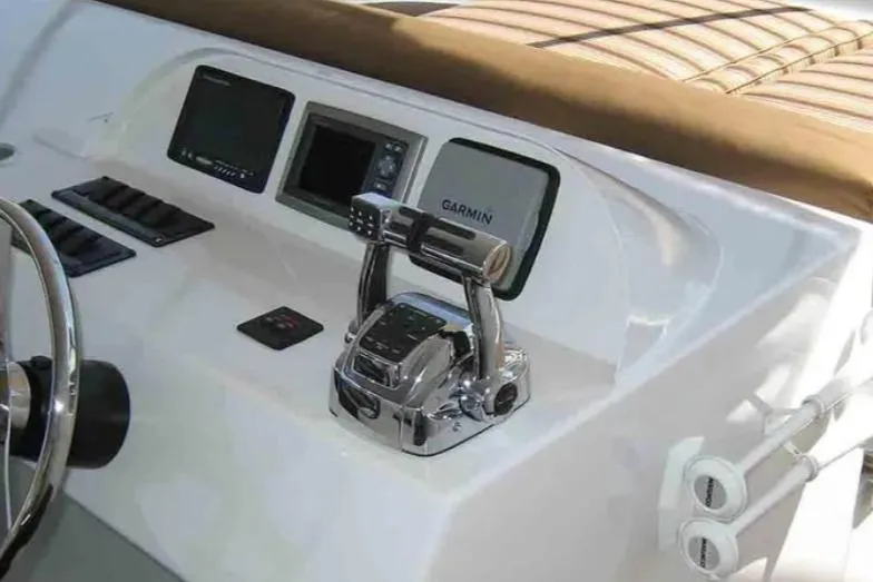 Slide: The Image of Control panel of 2012 Bravada Helios Share #8 boat with Garmin navigation system. - 27