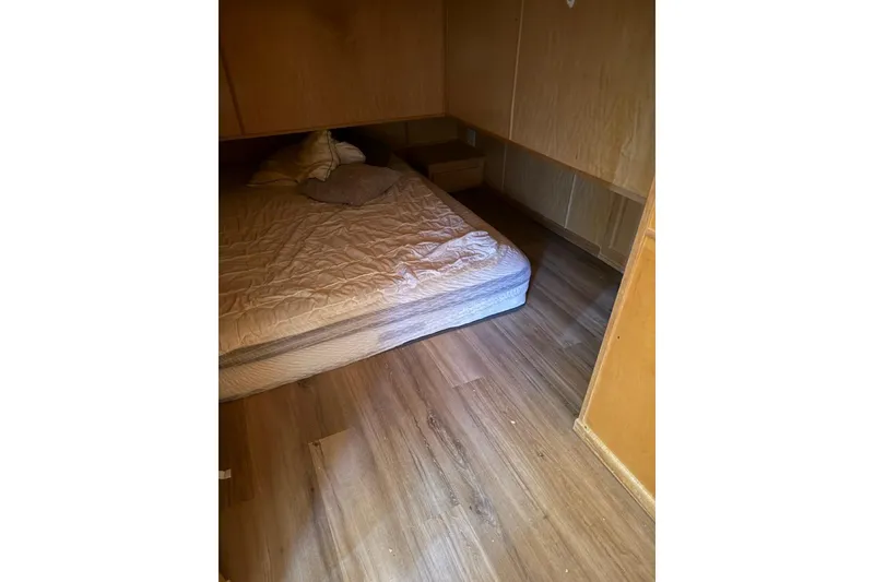 Slide: The Image of Cozy bedroom in 2004 Sharpe Houseboat, San Juan Sunrise Share #30, with wooden flooring. - 8