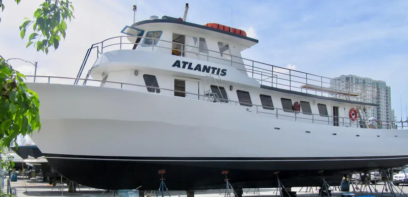 The Image of Commercial drift fishing boat "Atlantis" docked, 1986 model, clear sky background. - 0