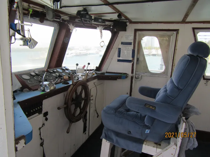 Slide: The Image of Interior of 1986 Drift Fishing Party boat with steering wheel and captain's chair. - 24