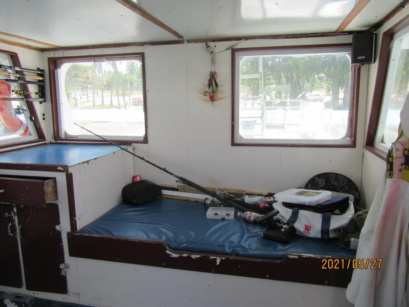 Slide: The Image of Interior of 1986 Drift Fishing Party boat with fishing gear and seating. - 25