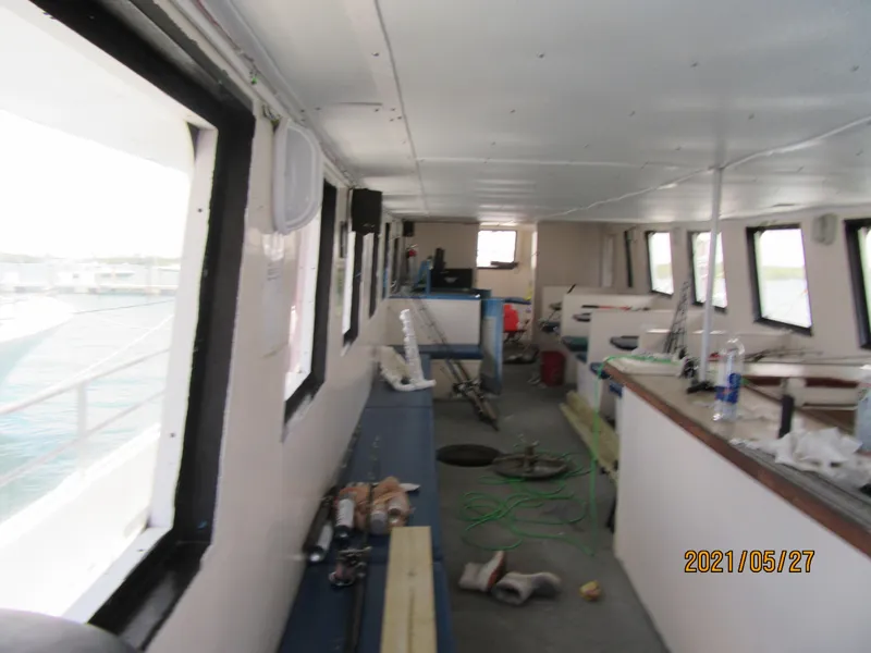 Slide: The Image of Interior of 1986 Commercial Drift Fishing Party boat, showing equipment and seating. - 38