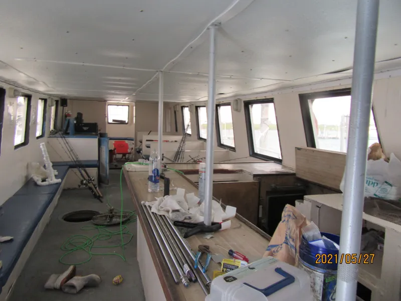 Slide: The Image of Interior of 1986 Drift Fishing Party boat, showing seating and equipment. - 39