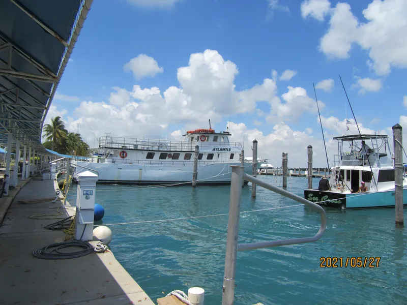 Slide: The Image of Drift fishing boat docked at marina under blue sky, 1986 model. - 4