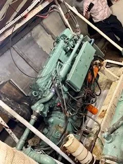 Slide: The Image of Engine room of 1986 Drift Fishing Party boat, featuring complex machinery and wiring. - 44