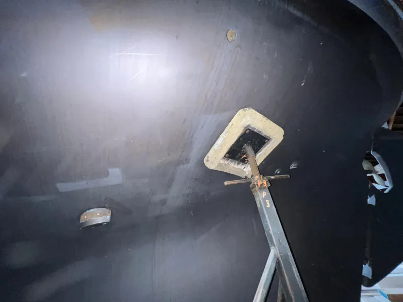 Slide: The Image of Close-up of the hull of a 1965 Allied Marine Sea Wind 30 sailboat. - 15