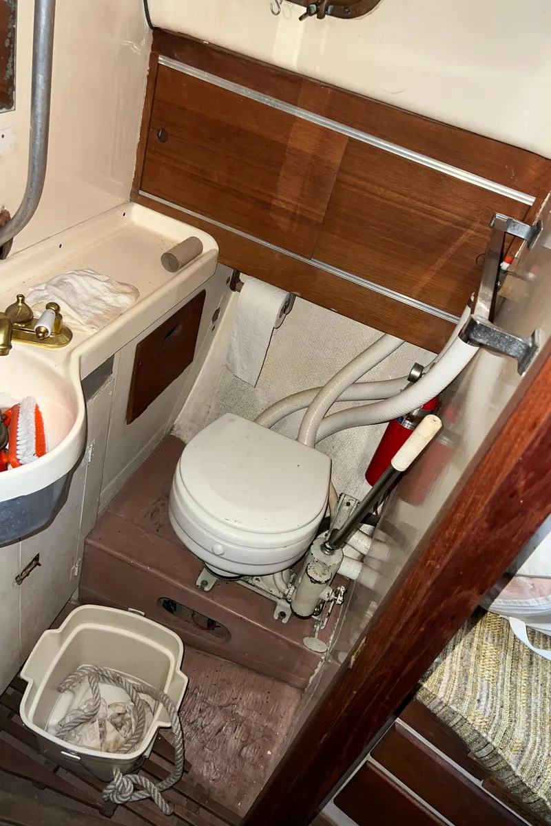 Slide: The Image of 1965 Allied Marine Sea Wind 30 boat bathroom with sink and toilet - 17