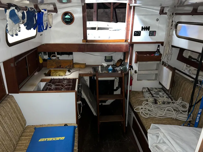 Slide: The Image of Interior of 1965 Allied Marine Sea Wind 30 sailboat with kitchen and seating area. - 7