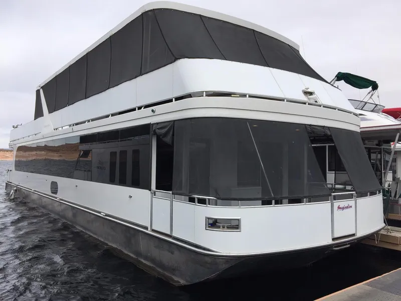 Slide: The Image of 2014 Bravada Imagination Share #4 houseboat, sleek design, docked on water. - 1