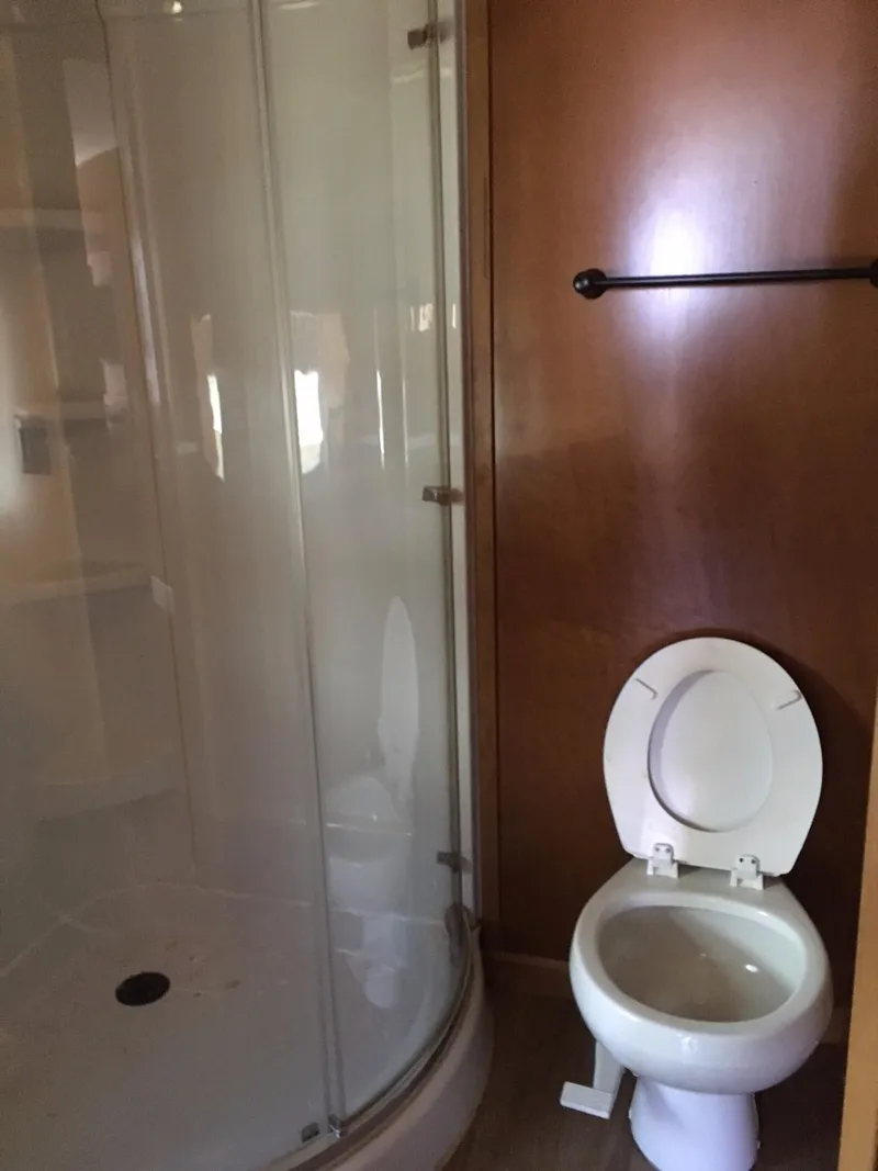 Slide: The Image of Compact bathroom in 2014 Bravada Imagination Share #4 RV with shower and toilet. - 18