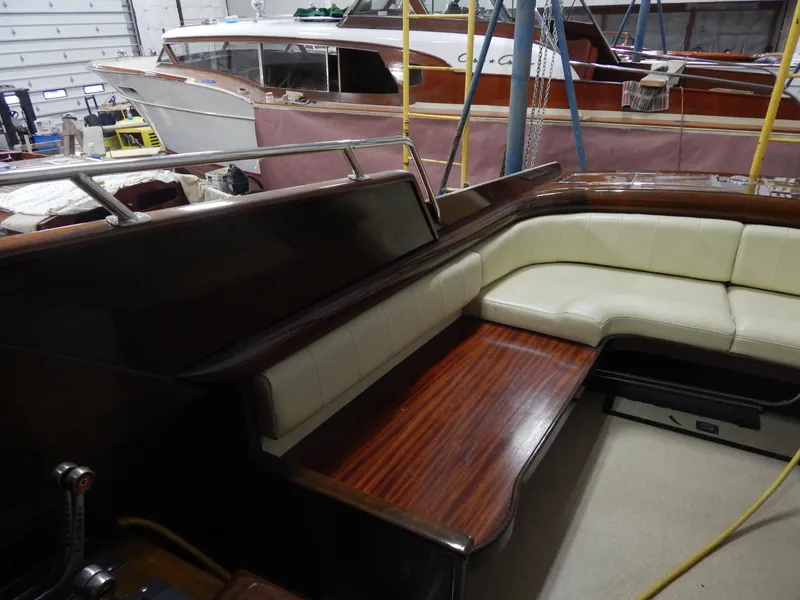 Slide: The Image of Luxurious 1990 Mays Craft 44 boat interior with elegant wood and cream seating. - 20
