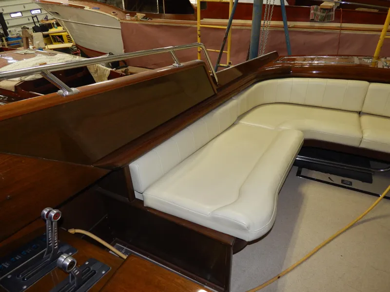 Slide: The Image of Luxurious interior of 1990 Mays Craft 44 boat with white leather seating. - 21