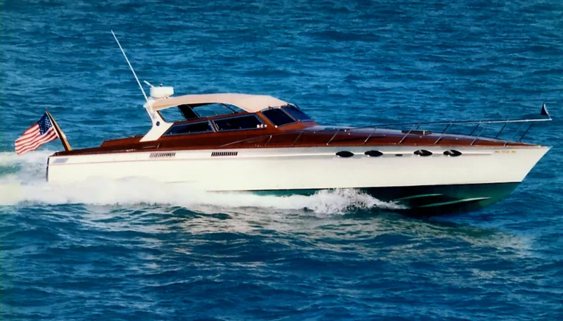 Slide: The Image of Mays Craft 44 yacht from 1990 cruising on blue ocean waters. - 8