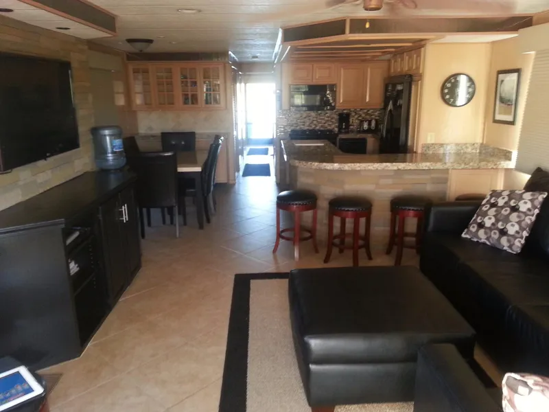 Slide: The Image of Interior of 2001 Stardust Cruisers Desert Oasis Share 20, featuring modern kitchen and cozy living area. - 2