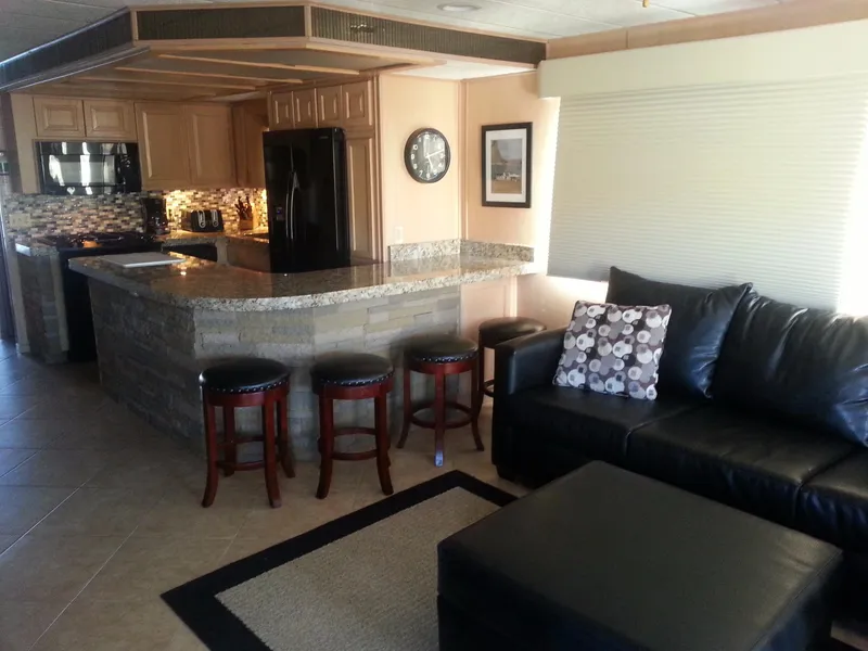 Slide: The Image of Luxurious interior of 2001 Stardust Cruisers Desert Oasis Share 20 with modern kitchen and cozy seating. - 4