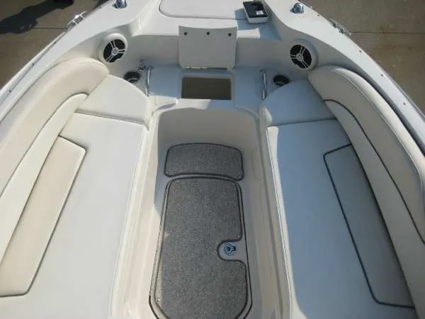 Slide: The Image of Interior of a 2008 Sea Ray 260 Sundeck boat, white upholstery. - 10