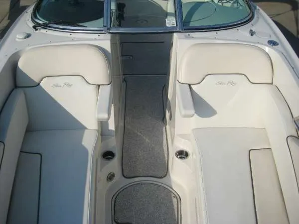 Slide: The Image of Interior of a 2008 Sea Ray 260 Sundeck boat with beige seating. - 11