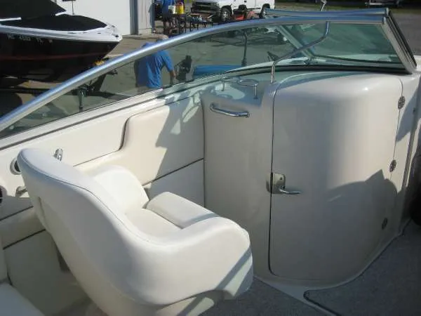 Slide: The Image of Interior of a 2008 Sea Ray 260 Sundeck boat with white seating. - 15