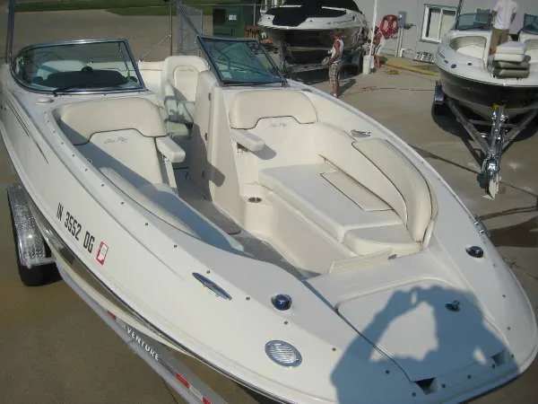 Slide: The Image of 2008 Sea Ray 260 Sundeck boat on a trailer outdoors. - 3