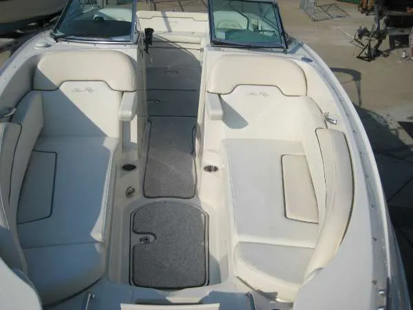 Slide: The Image of Interior view of a 2008 Sea Ray 260 Sundeck boat with white seating. - 4